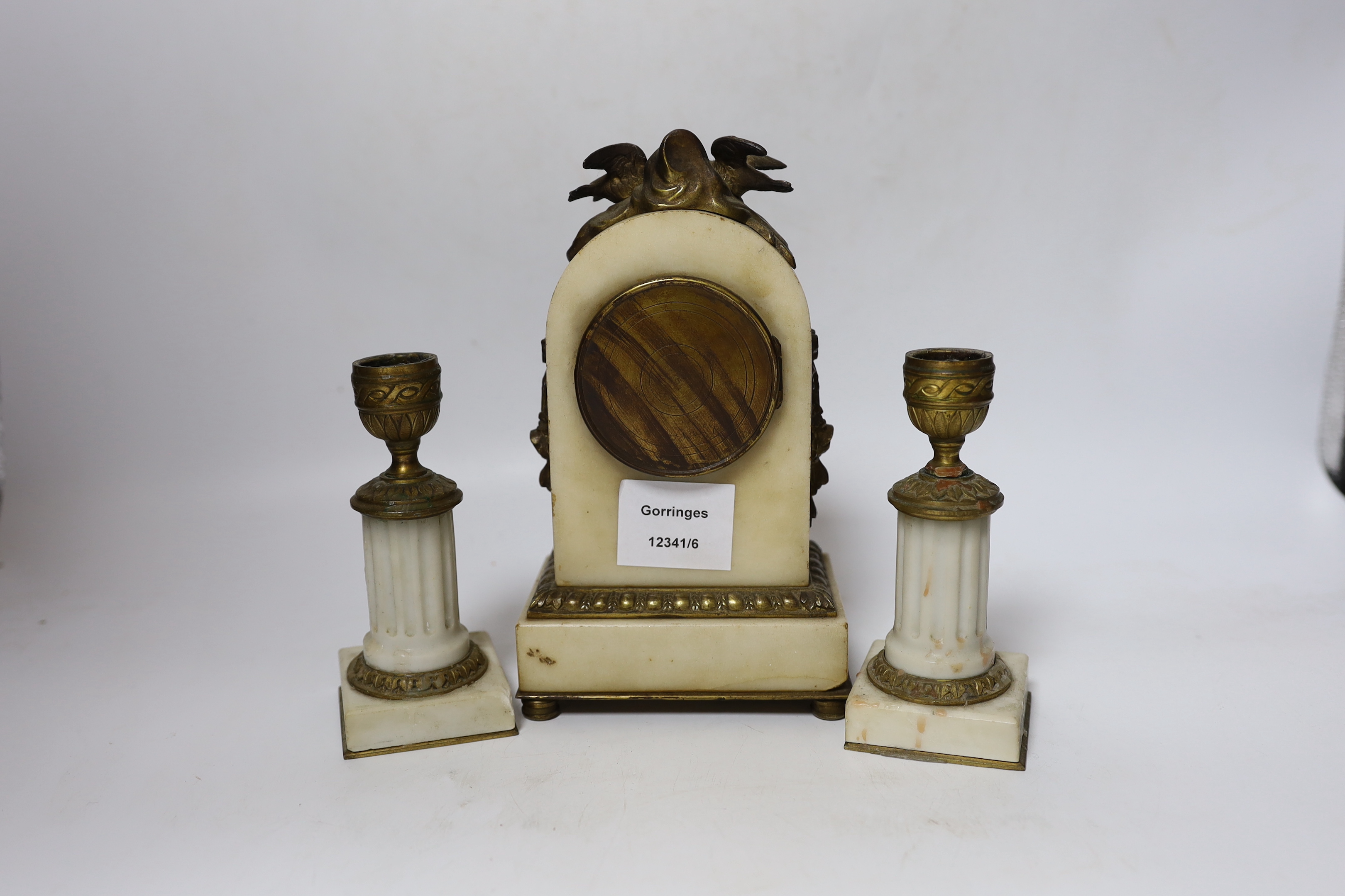 A French marble and ormolu clock garniture, early 20th century, clock 21cm high